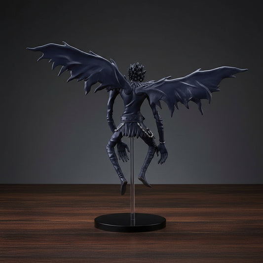 Dark blue fantasy creature figurine with wings on a white background