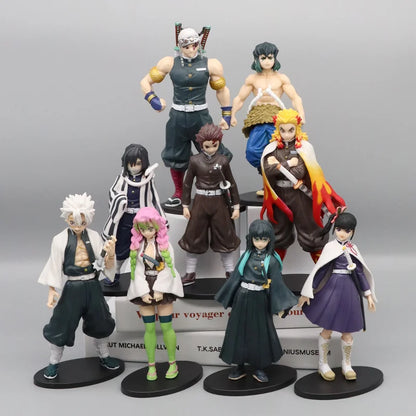 Collection of anime figurines on a gray background