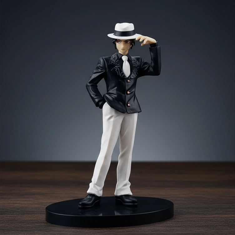 Figurine of a character in a black suit and white hat on a white background