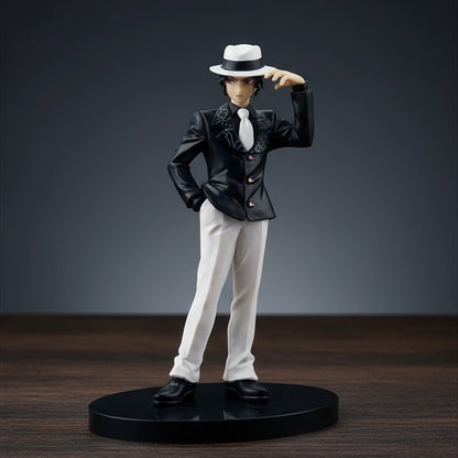Figurine of a character in a black suit and white hat on a white background