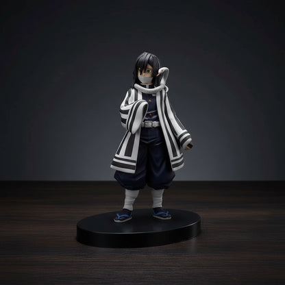 Figurine of an animated character in a black and white outfit on a white background
