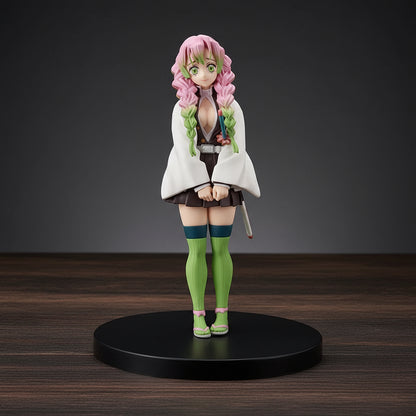 Anime character figurine with pink hair and green eyes on a black base