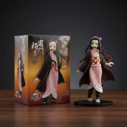 Anime character figurine next to its packaging on a wooden surface with a dark background