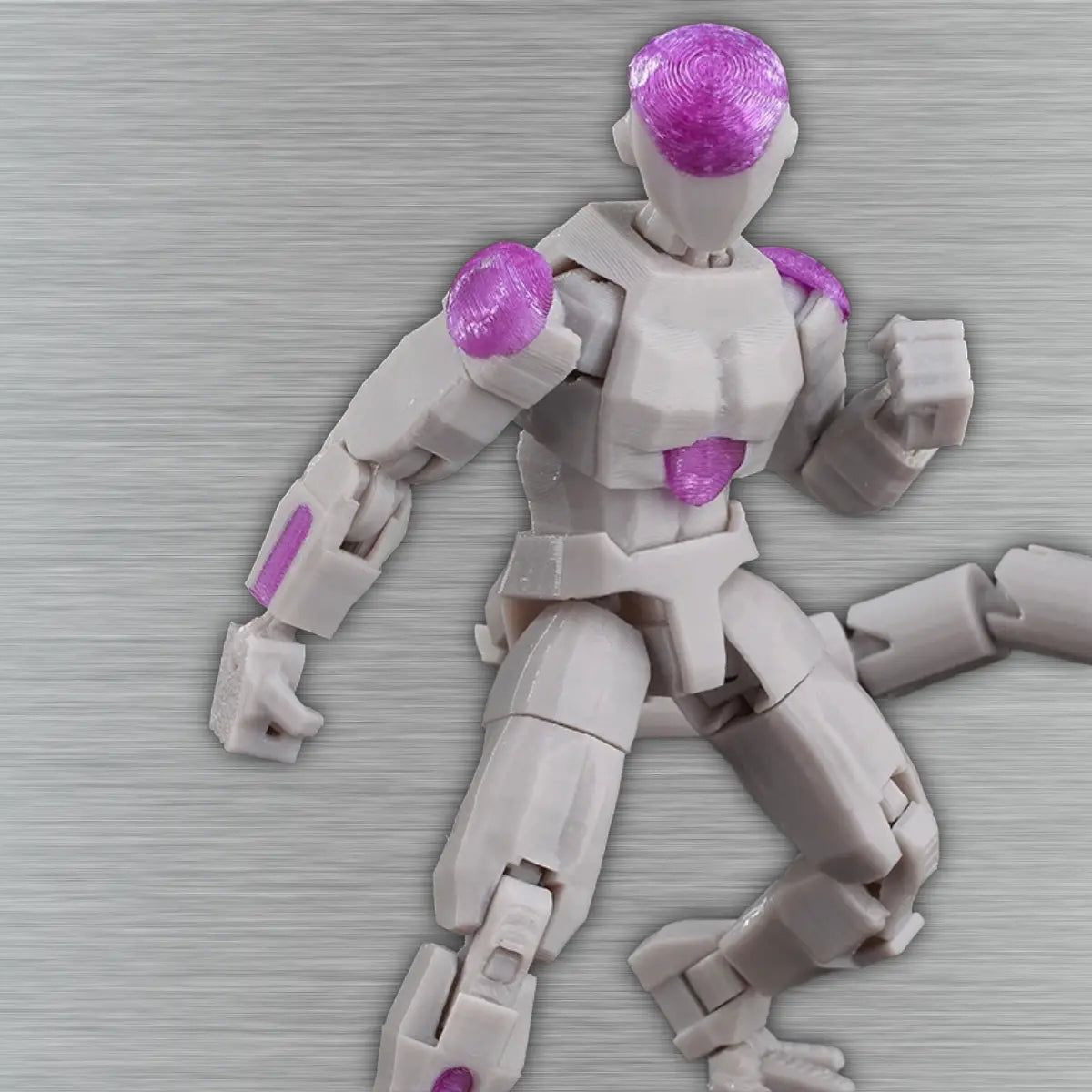 Toy figure with purple and gray components on a textured surface