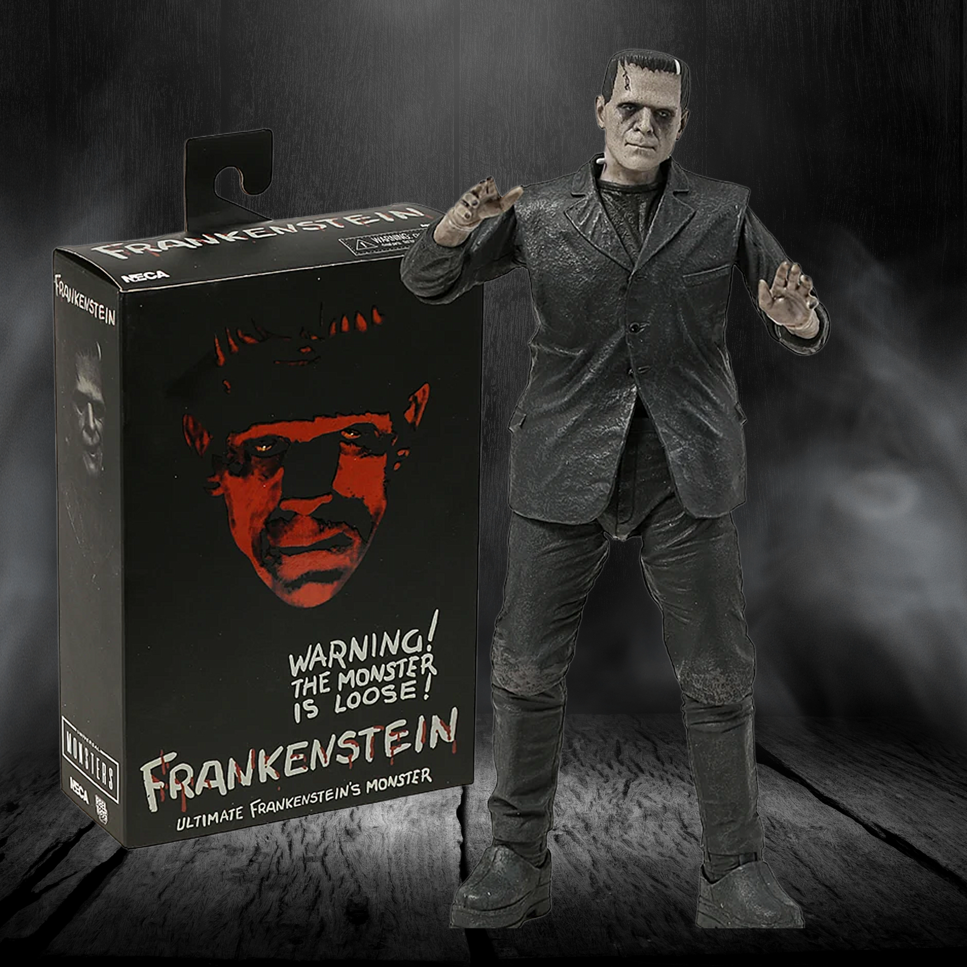 Frankenstein action figure next to its packaging with a dark background
