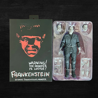 Frankenstein action figure with packaging on a dark background