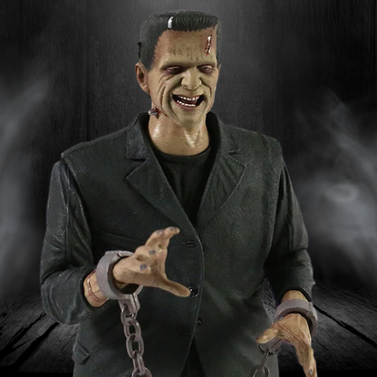 Action figure of a character in a dark coat with chains, against a dark background