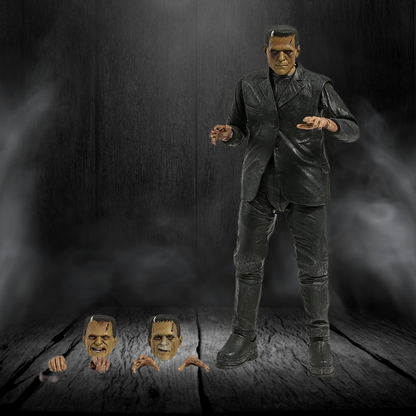Action figure of a character in a dark setting with three heads on a wooden surface.