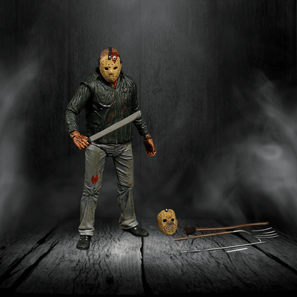 Action figure in a dark setting with a weapon and mask