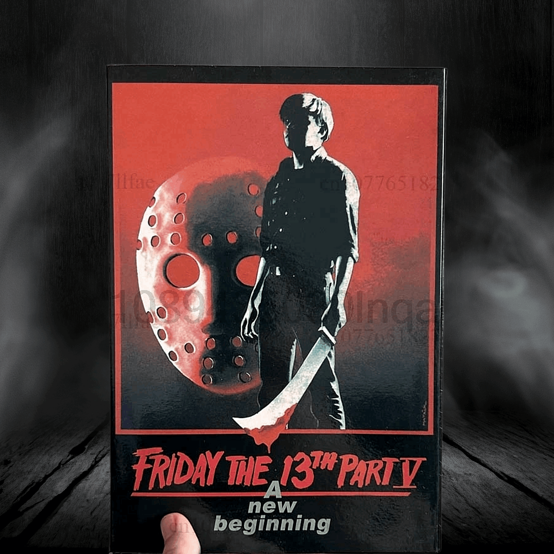 VHS tape cover of 'Friday the 13th Party V: A New Beginning' with a silhouette of a character holding a knife and a mask.