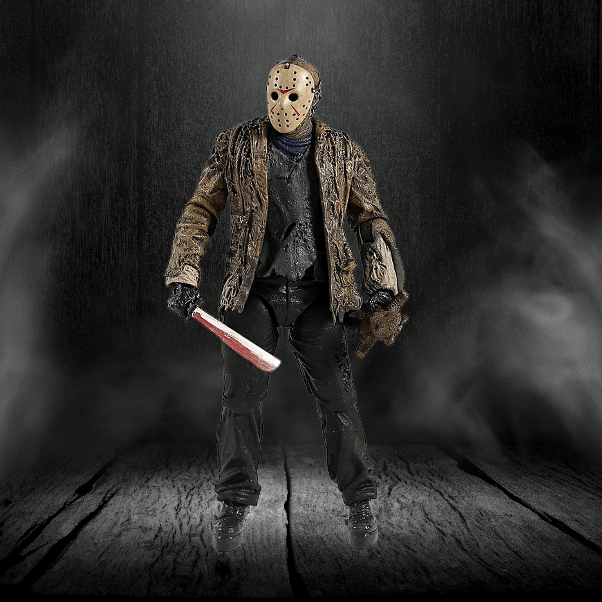 Action figure in a dark, smoky setting holding a knife