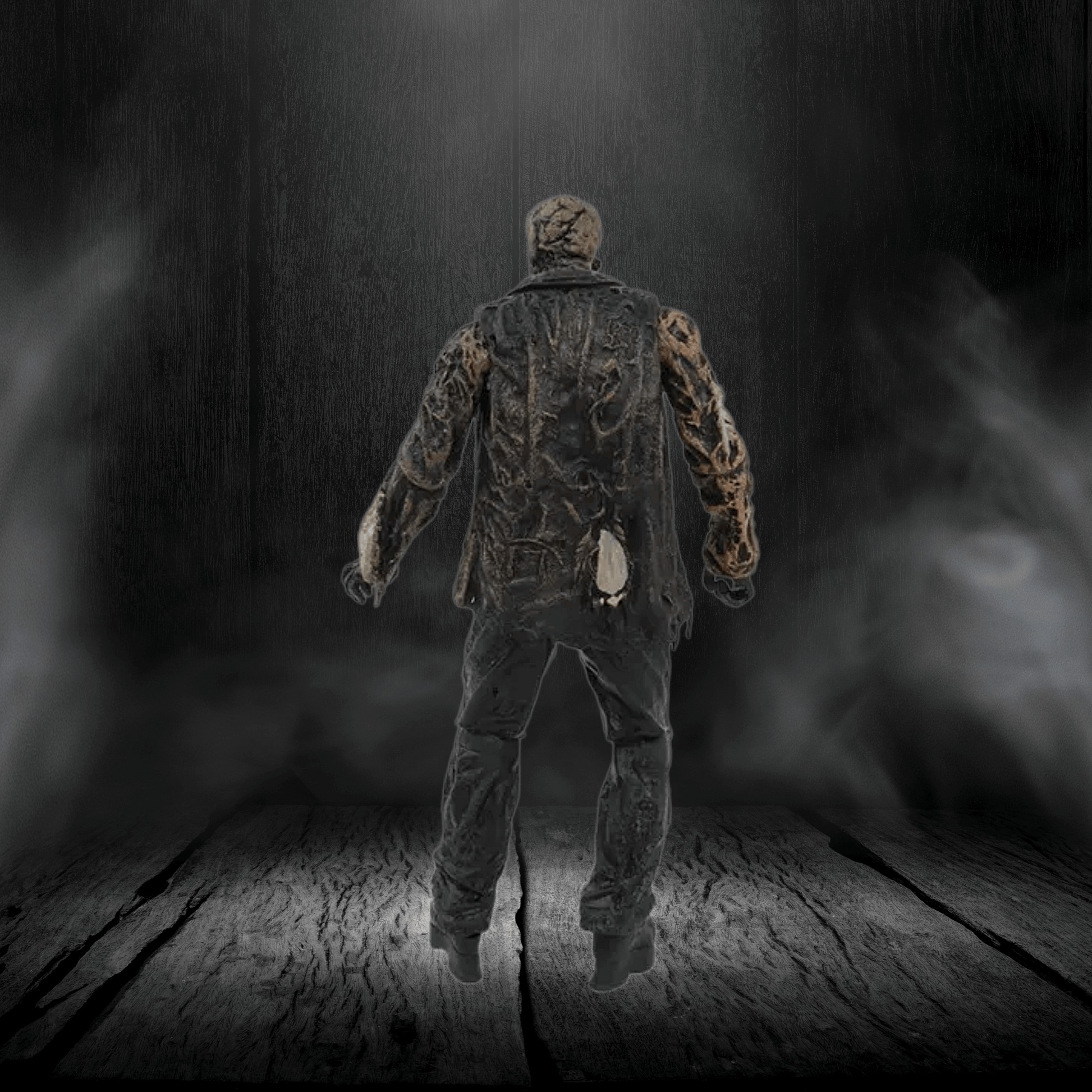 Mannequin in camouflage clothing standing on a wooden floor with a dark, smoky background