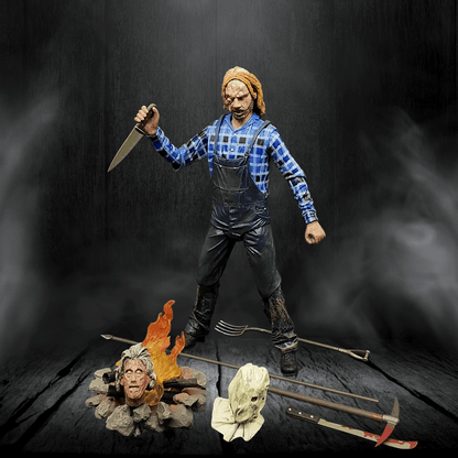 Action figure in a dramatic pose with a knife, surrounded by props on a dark background