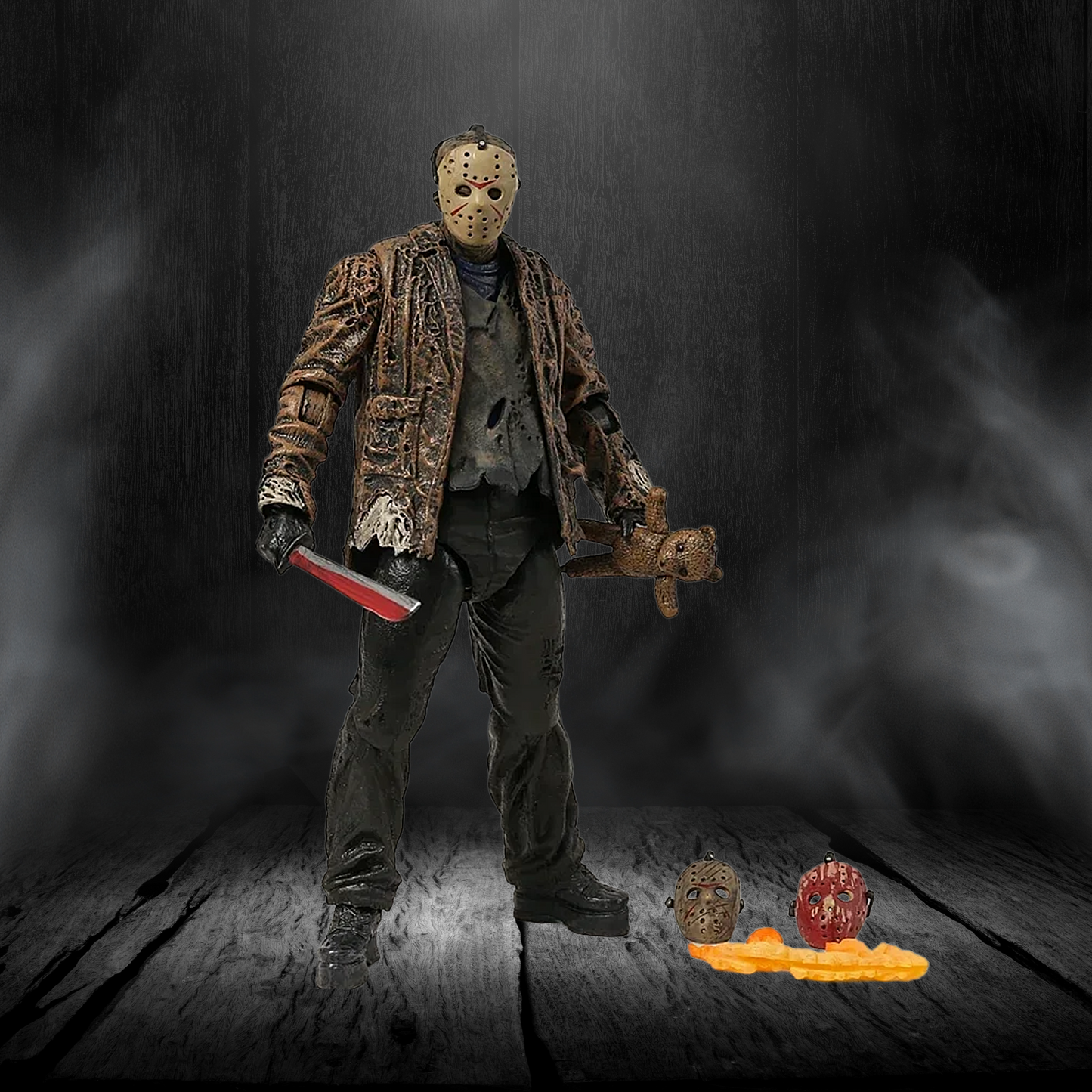 Action figure with a mask and knife on a dark background
