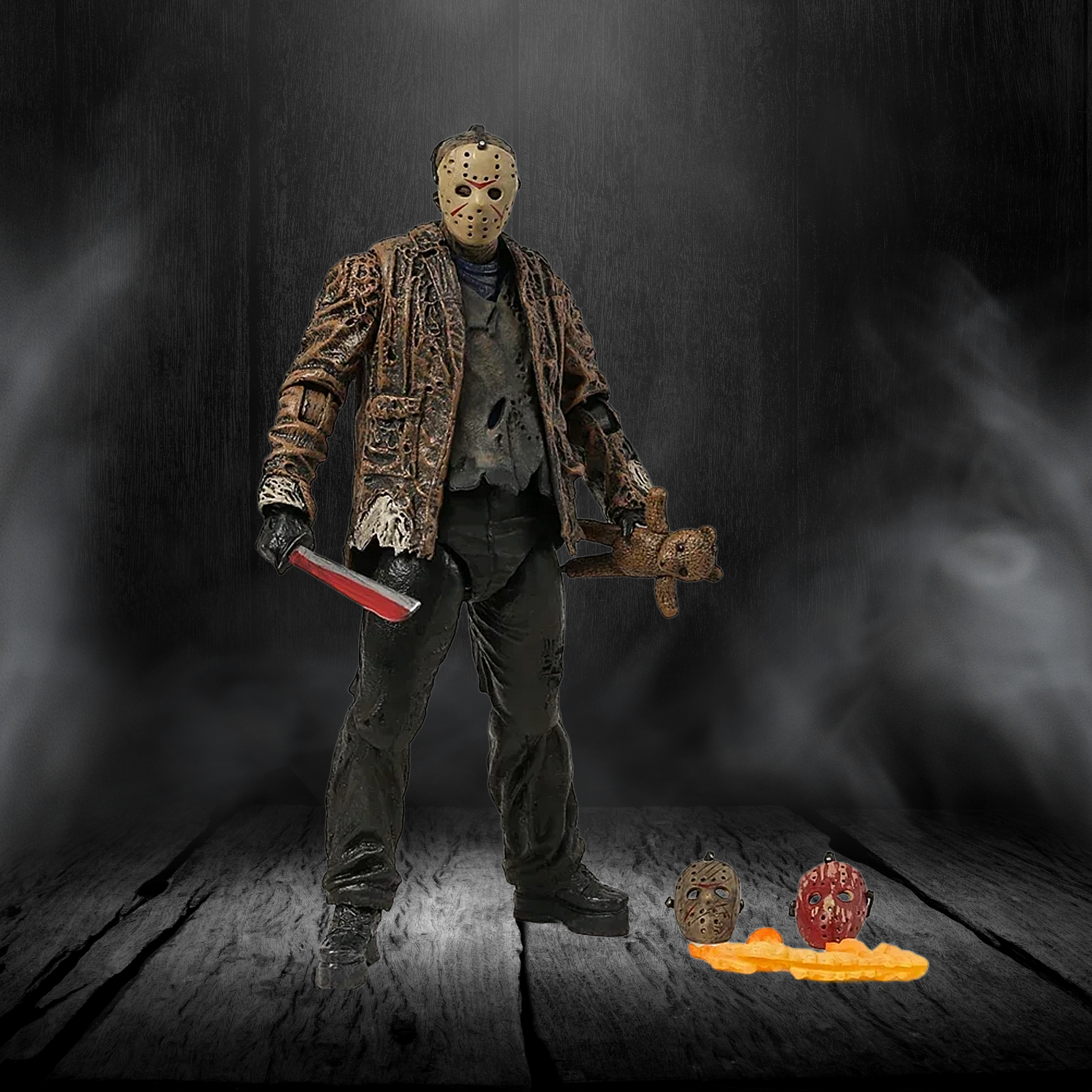 Action figure with a mask and knife on a dark background