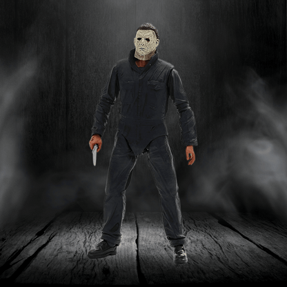 Action figure in a dark setting holding a knife