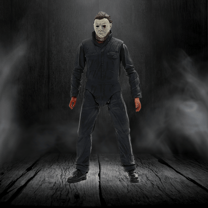 Person wearing a dark jumpsuit and mask in a dark, smoky setting