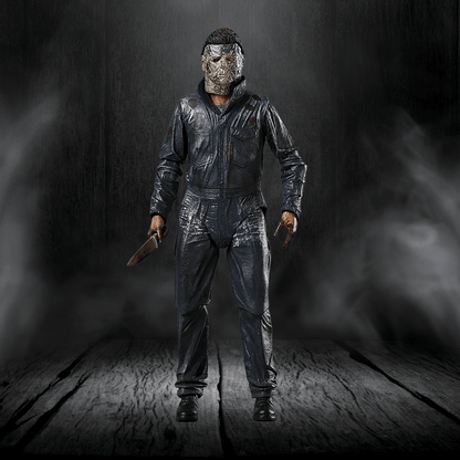 Action figure in a dark, smoky setting holding a knife.