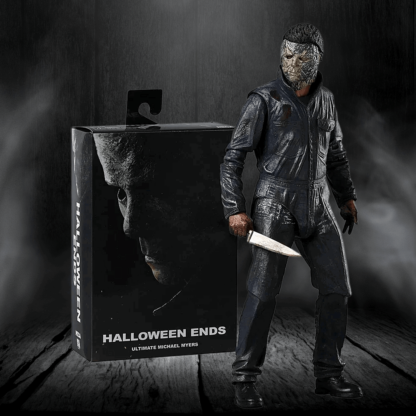 Action figure of a character from 'Halloween Ends' next to its packaging on a dark background