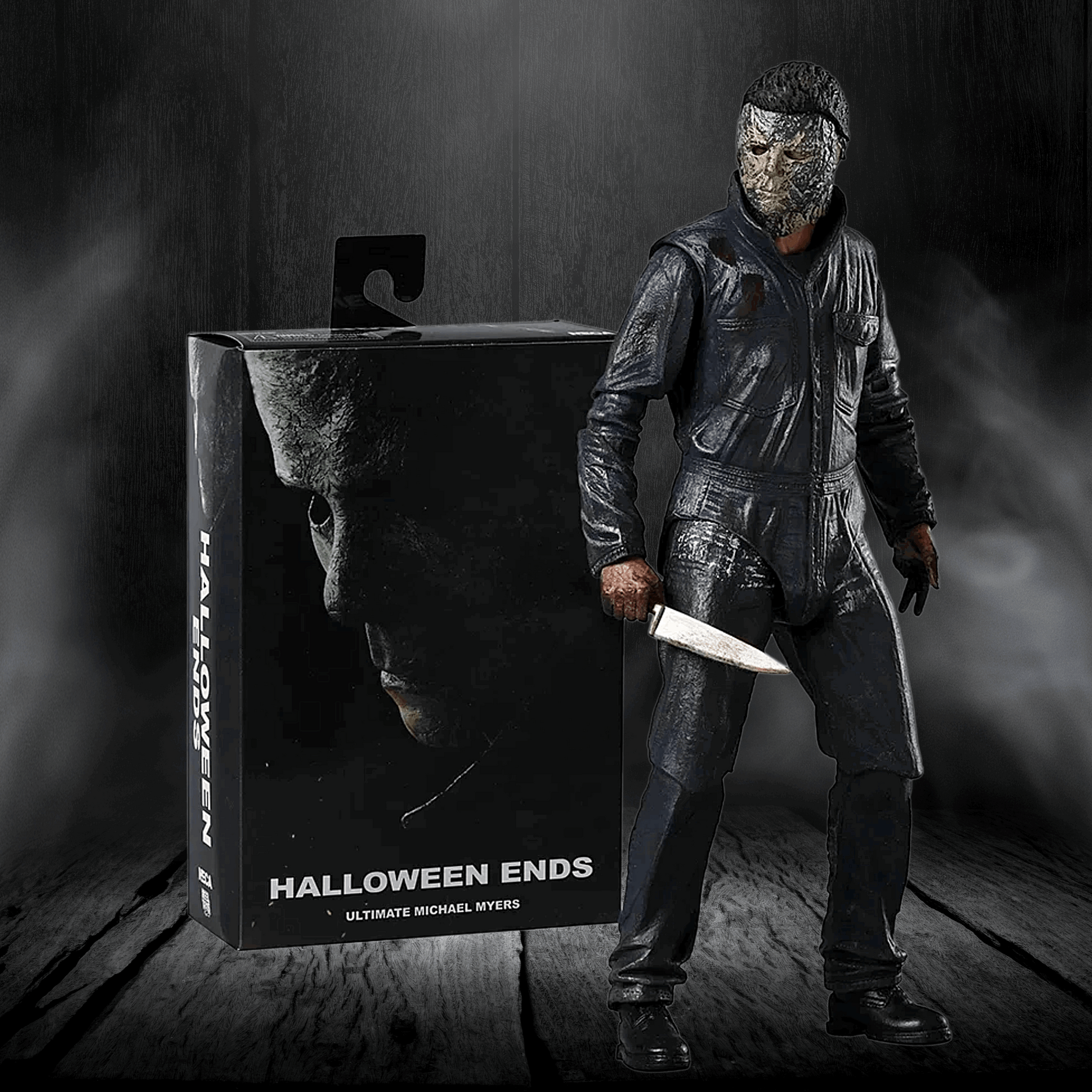 Action figure of a character from 'Halloween Ends' next to its packaging on a dark background