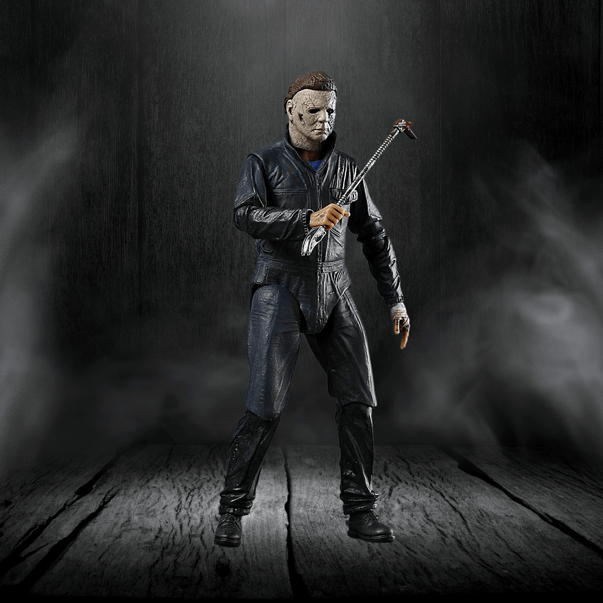 Action figure in a dark setting holding a weapon
