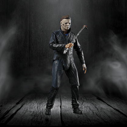 Action figure in a dark setting holding a weapon