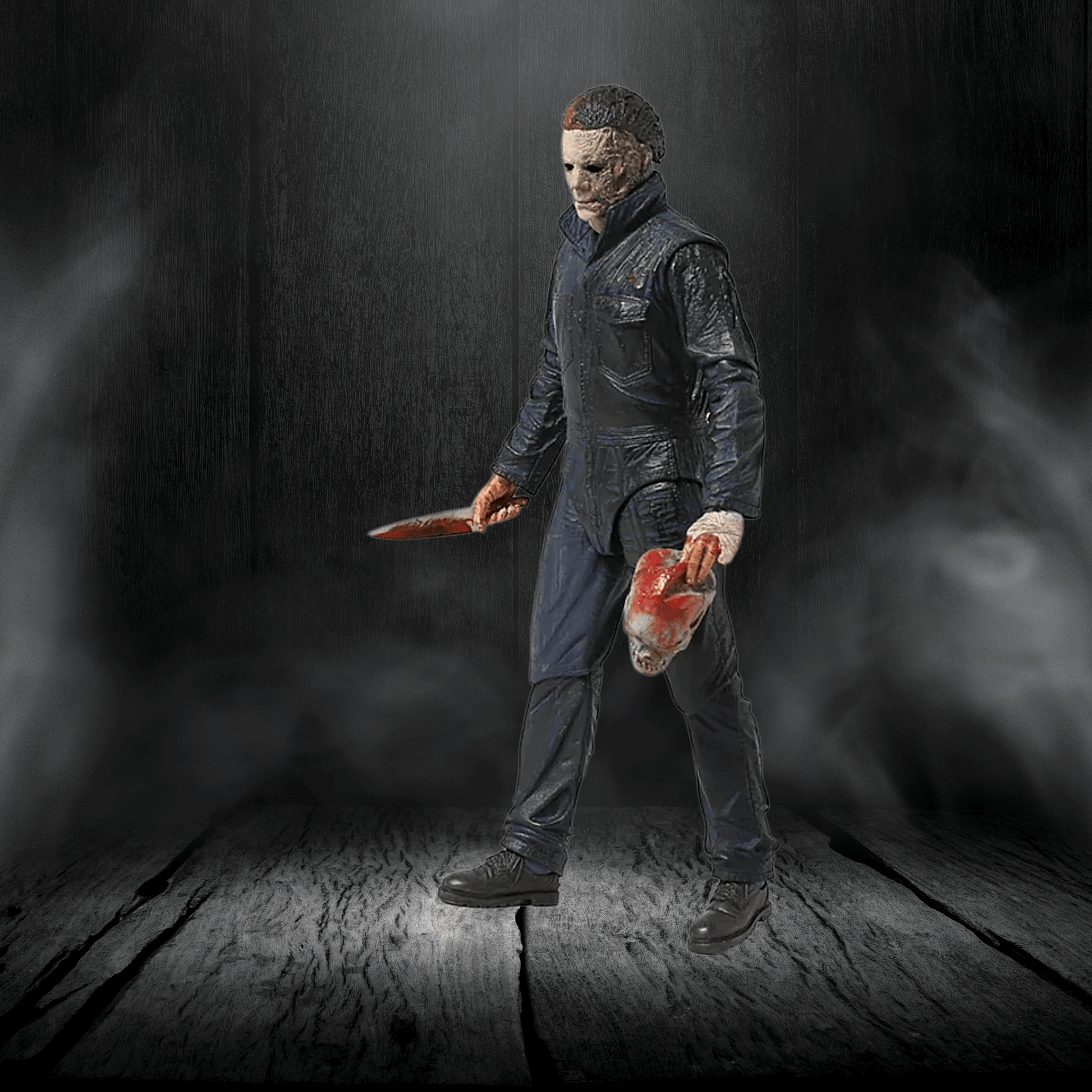 Action figure holding a knife and a head in a dark, smoky setting
