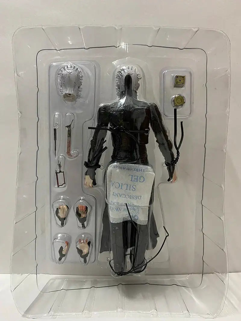Action figure in clear packaging with visible branding on a white background