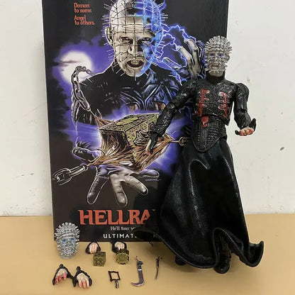 Horror movie action figure with accessories in front of a 'Hellraiser' movie poster.