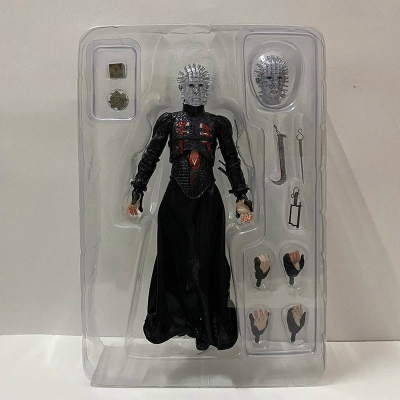 Action figure in clear packaging with accessories on a white background