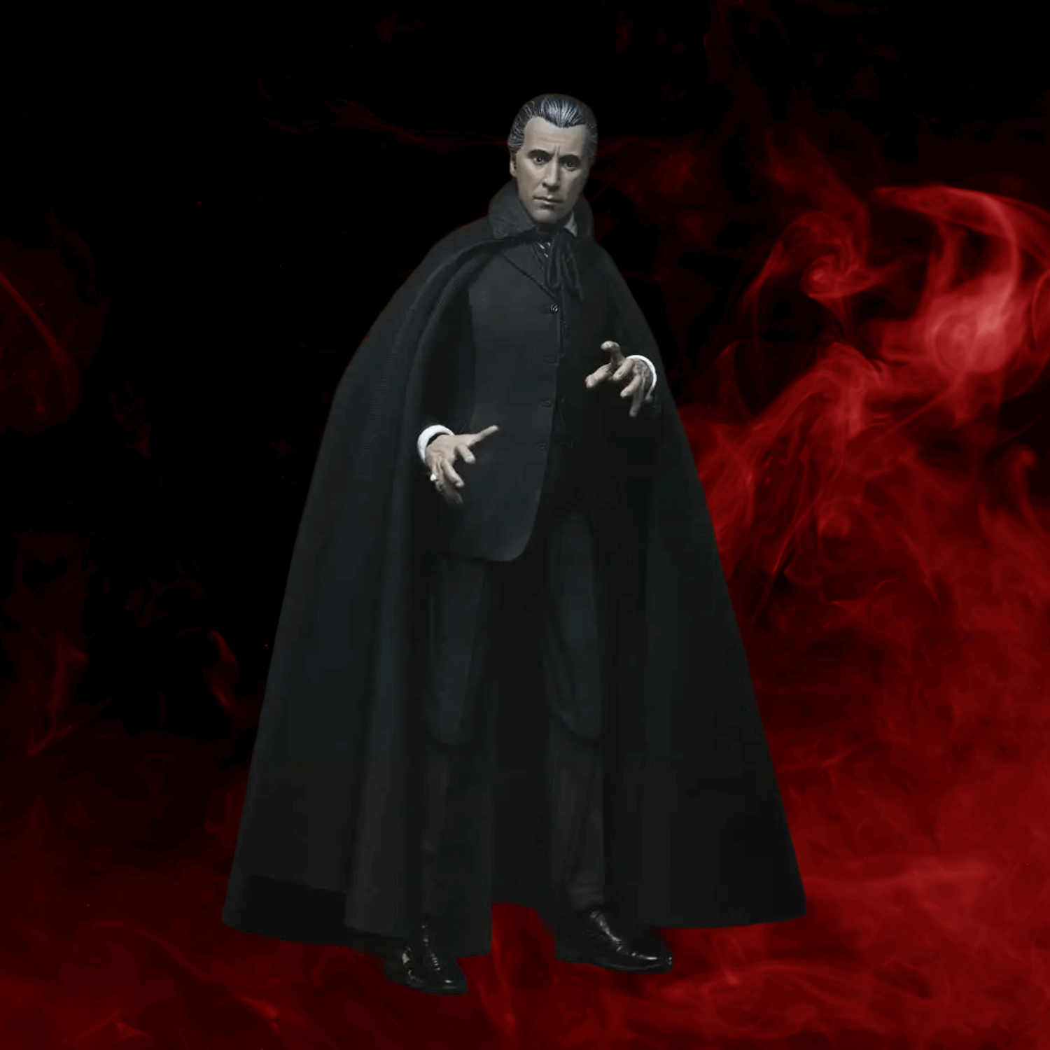 Action figure in a black cloak against a red and black background
