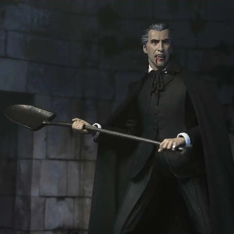 Vampire figurine holding a spoon against a stone wall background