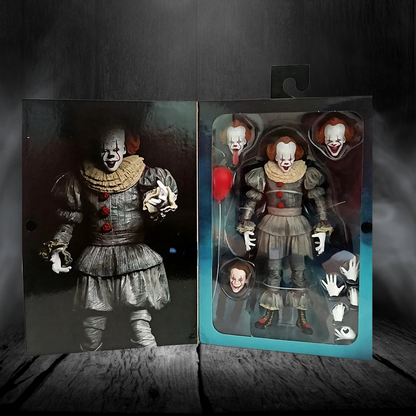 Action figure of a clown in a dark setting with packaging