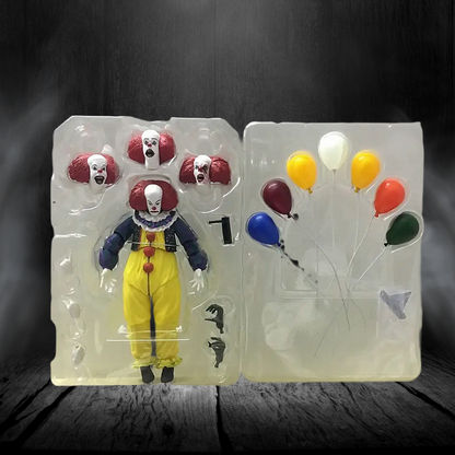 Toy figure of a clown in packaging with balloons on a dark background