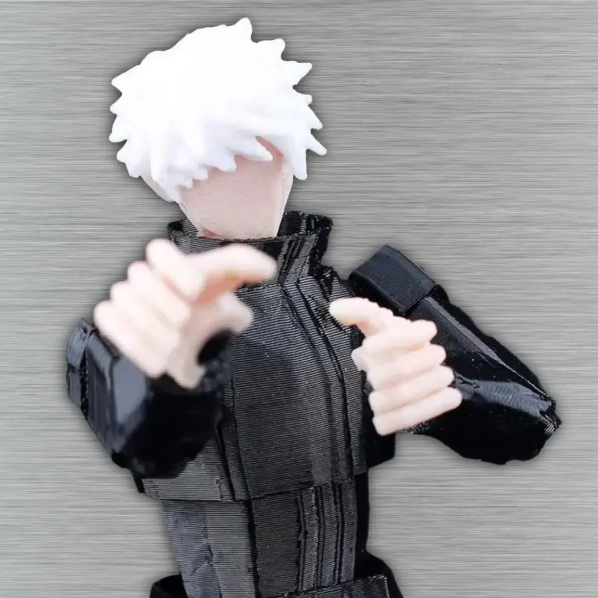 Plush toy of an anime character with white hair and black outfit on a gray background