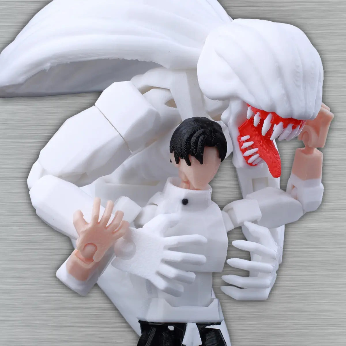 Action figure with a white suit and red mouth, lying on a textured surface.