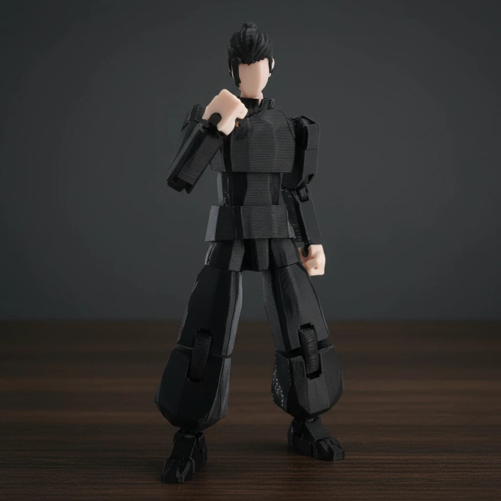 Black robot toy figure against a gray textured background