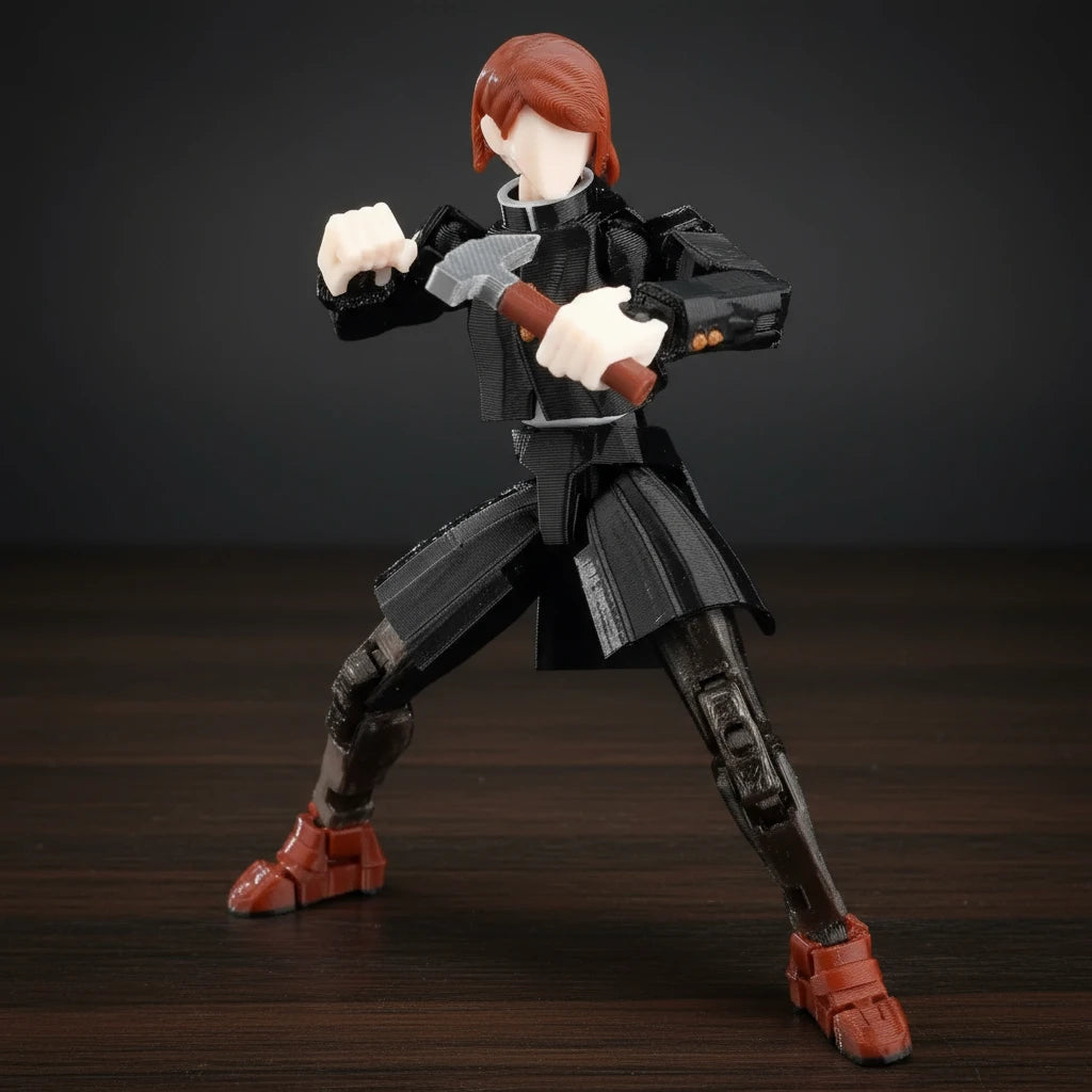Action figure with red hair and black outfit on a textured gray background