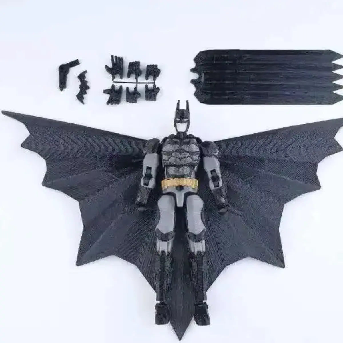 Batman action figure with additional parts on a white background