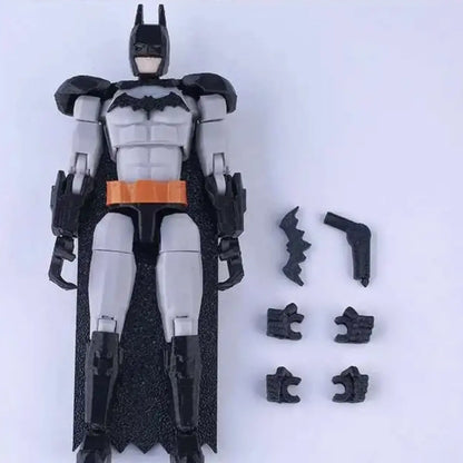 Batman action figure with detached parts on a white background