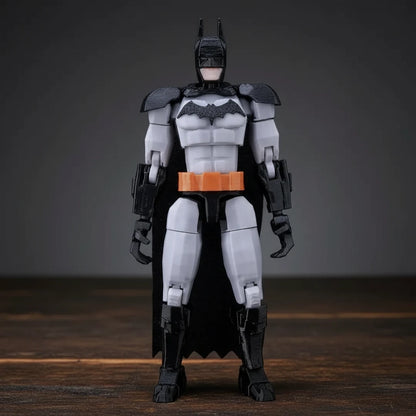 Action figure of a superhero in a black and gray costume with orange accents on a textured gray background