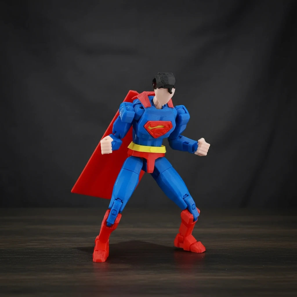 Superman action figure with red cape and blue suit on a textured gray background
