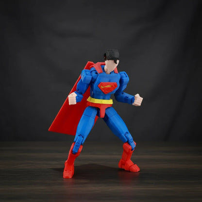 Superman action figure with red cape and blue suit on a textured gray background