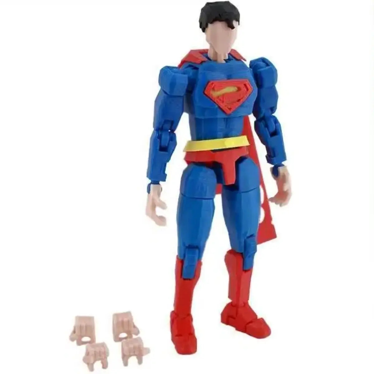 Superman action figure with blue suit and red cape on a white background