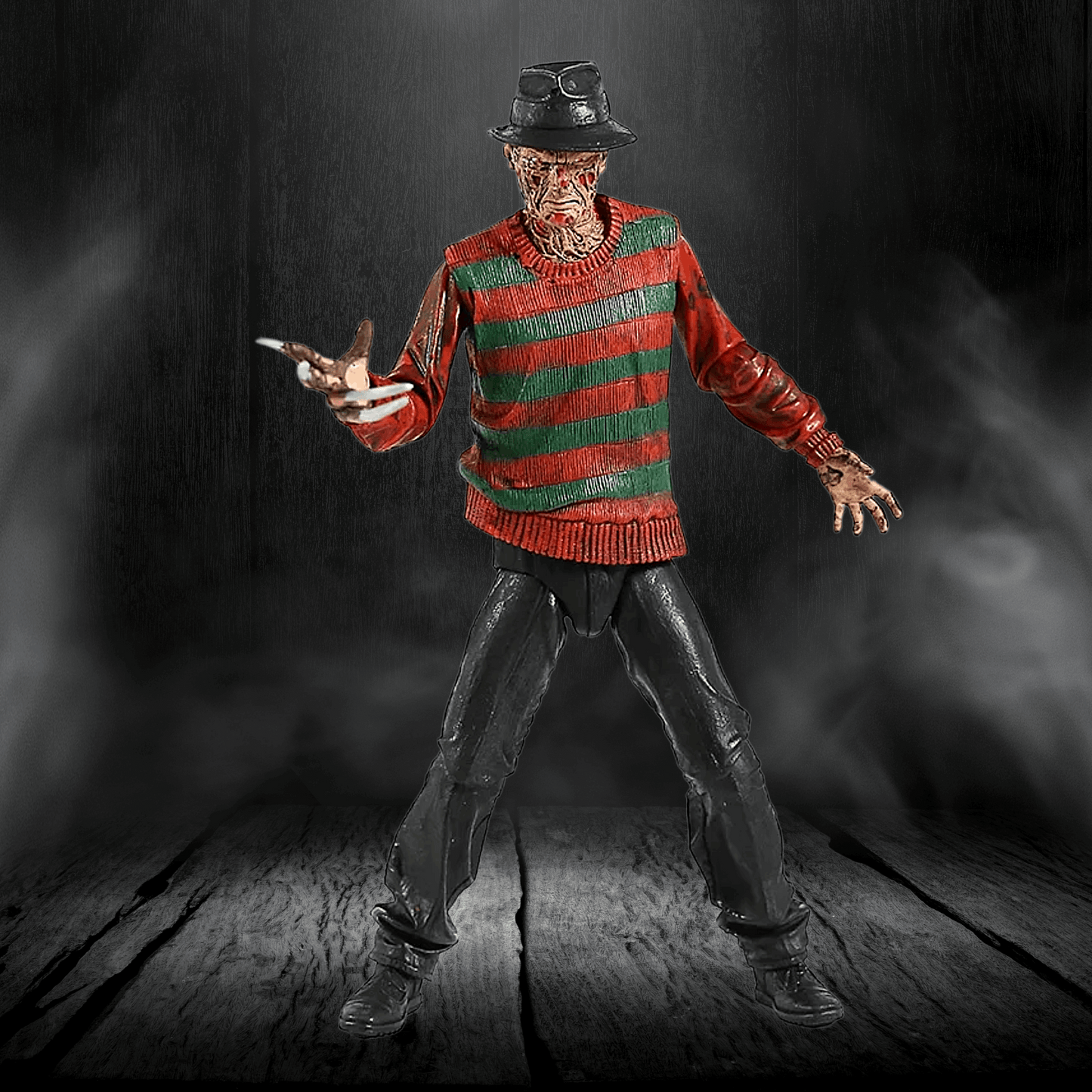 Action figure in a red and green striped sweater with a dark background