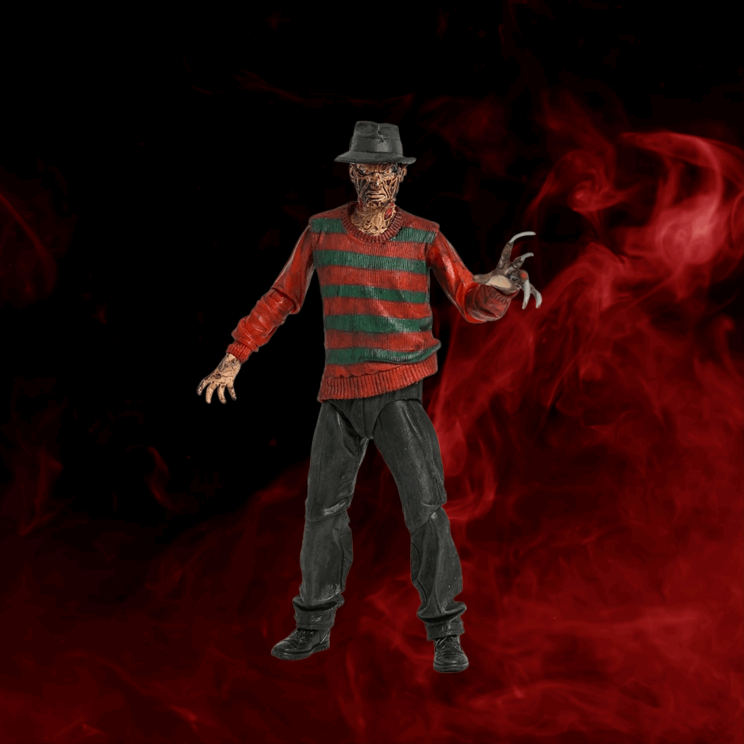 Action figure in a red and green striped sweater with a dark background