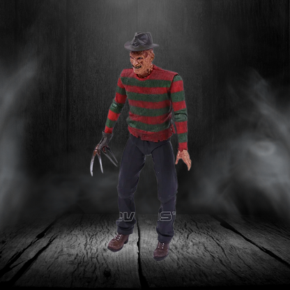 Action figure in a red and green striped sweater with a dark background