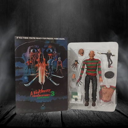 Freddy Krueger action figure in packaging with 'A Nightmare on Elm Street 3' movie poster
