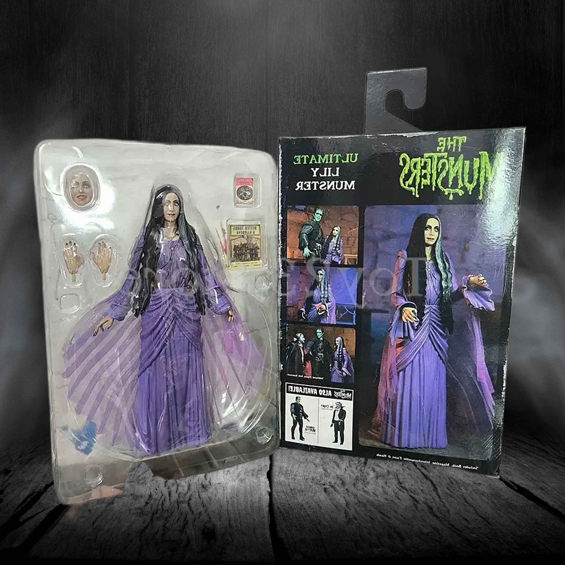Action figure in purple dress with packaging on a dark background