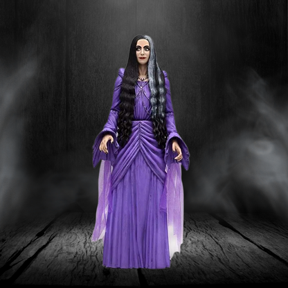 Action figure in a purple dress with long black hair against a dark background